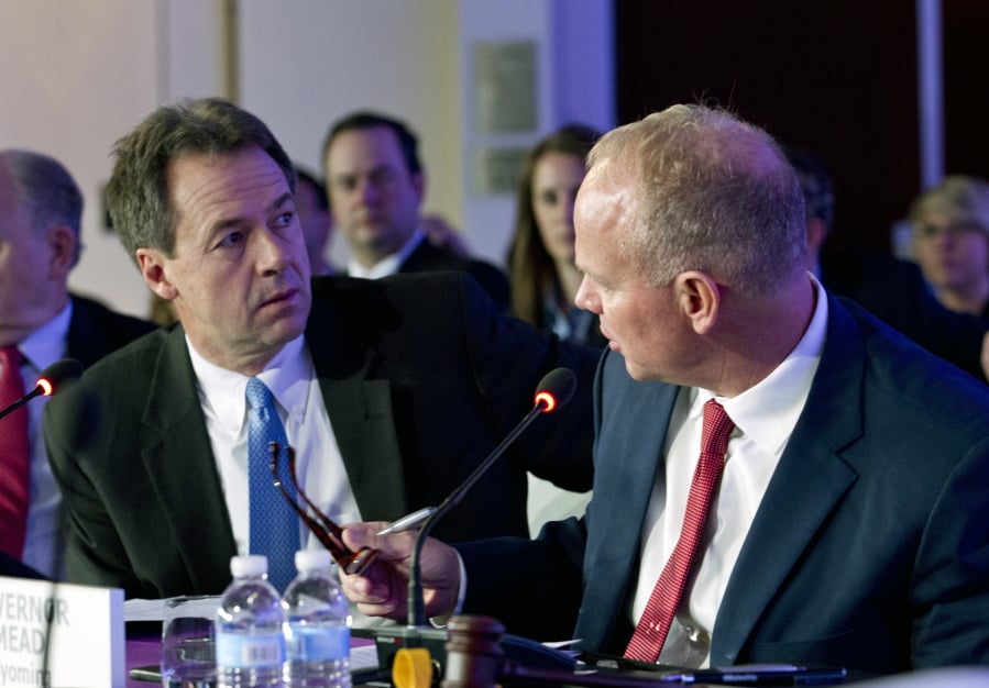 Gov. Steve Bullock speaks with Gov. Matt Mead of Wyoming during the National Governor Association 2018 winter meeting, on Saturday, Feb. 24, 2018, in Washington.