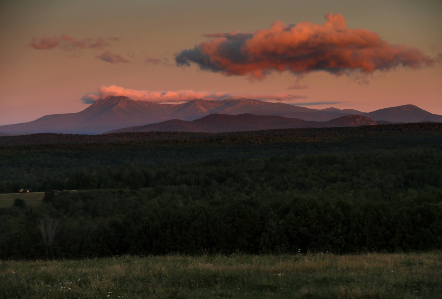 FILE - The Aug. 7, 2017 file photo shows Mount Katahdin at dawn, just west of the Katahdin Woods and Waters National Monument, a site administered by the U.S. Interior Department near Patten, Maine. A year of upheaval at the U.S. Interior Department has seen dozens of senior staff members reassigned and key leadership positions left unfilled, rules considered burdensome to industry shelved, and repeated complaints that dissenting views have been sidelined. (AP Photo/Robert F.