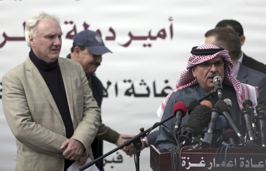 Matthias Schmale, UNRWA’s director in Gaza, left, listens to the Qatari envoy, Mohammed Al-Emadi, during a press conference at the Shifa hospital in Gaza City, Gaza, on Monday. Al-Emadi said Monday that both Israel and militants in Gaza want to contain cross-border violence that has flared-up in recent days as he detailed a new emergency fund to aid the impoverished territory ruled by the Islamic militant group Hamas.