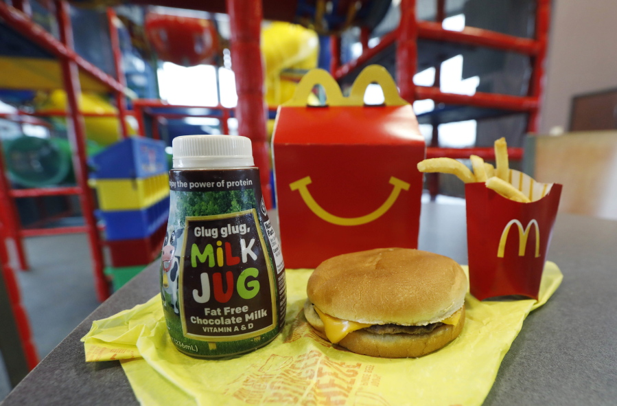 A Happy Meal featuring non-fat chocolate milk and a cheeseburger with fries, are arranged for a photo at a McDonald’s restaurant in Brandon, Miss., Wednesday. (AP Photo/Rogelio V.