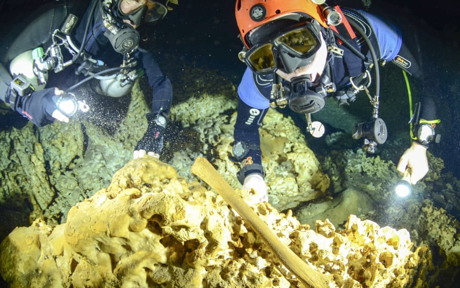 Divers from the Great Mayan Aquifer project explore the Sac Actun underwater cave system where Mayan and Pleistocene bones and cultural artifacts have been found submerged, near Tulum, Mexico.