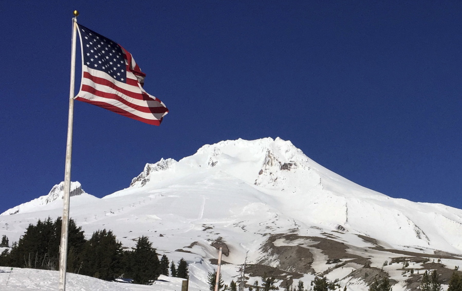 Oregon’s Mount Hood is seen Tuesday from Timberline Lodge on the south side of the mountain. Authorities said a climber who fell up to 1,000 feet and was airlifted off the mountain died. Several other climbers were stranded on the mountain, prompting a complicated rescue effort.