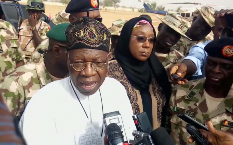 In this image taken from video, Lai Muhammed, Nigerian Minister of Information, speaks to the media in Dapchi, Yobe State, Nigeria, on Thursday Feb. 22, 2018. Parents in northern Nigeria say more than 100 girls are still missing three days after suspected Boko Haram extremists attacked their school. The announcement comes after government officials in Yobe state acknowledged that some 50 young women remained unaccounted for in the Monday evening attack.