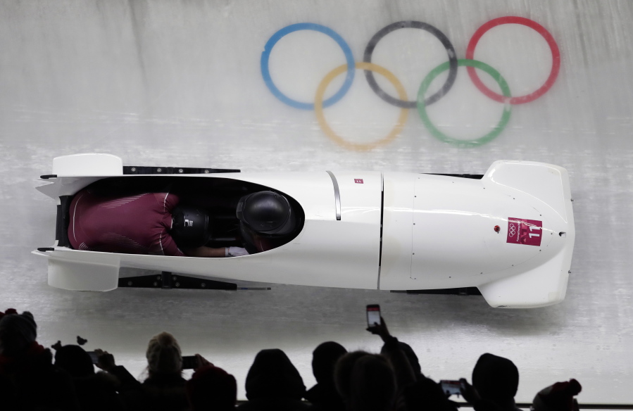 Driver Nadezhda Sergeeva and Anastasia Kocherzhova of the Olympic Athletes of Russia take a curve in their third heat during the women’s two-man bobsled final at the 2018 Winter Olympics in Pyeongchang, South Korea, on Wednesday.