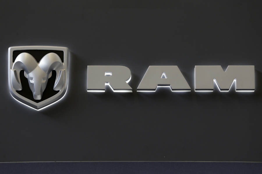 The Ram truck logo appears on a sign at the Pittsburgh Auto Show in Pittsburgh in February 2013. Fiat Chrysler is recalling about 229,000 Ram trucks, mostly in North America, because they can be shifted out of park without a key in the ignition or a foot on the brake. Gene J.