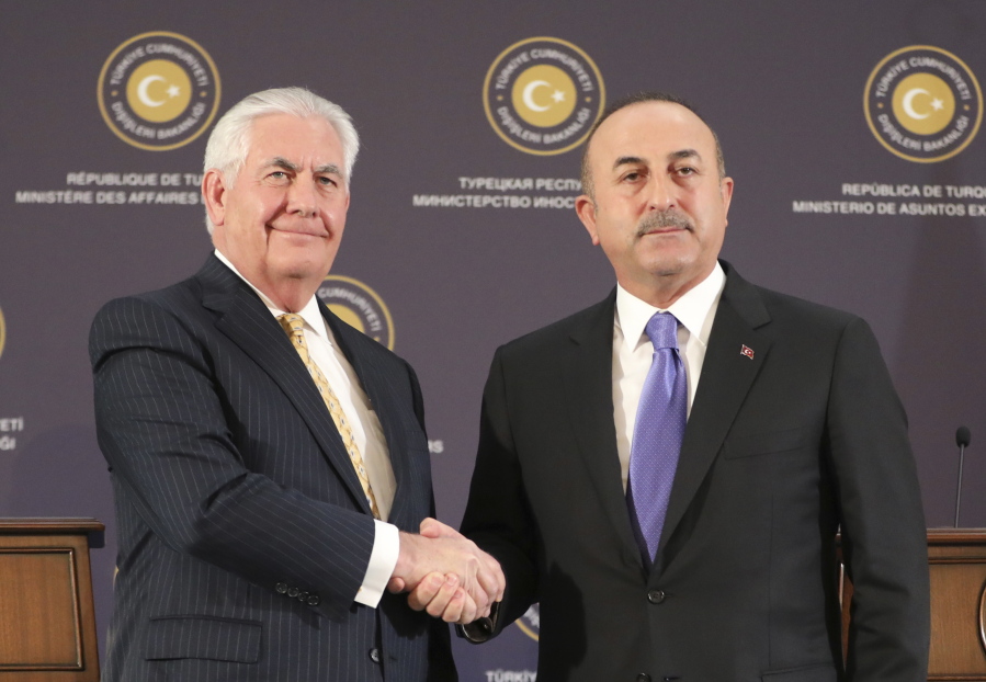Turkey’s Foreign Minister Mevlut Cavusoglu, right, shakes hands with U.S. Secretary of State Rex Tillerson, left, after a joint news conference following their meeting in Ankara, Turkey, Friday, Feb. 16, 2018. The talks in Ankara were to focus on Washington’s plan to continue providing the Kurdish militants assistance and Turkey’s military operation in a Syrian Kurdish-controlled enclave in northern Syria, that had caused some of the worst tensions in years between the two NATO allies.