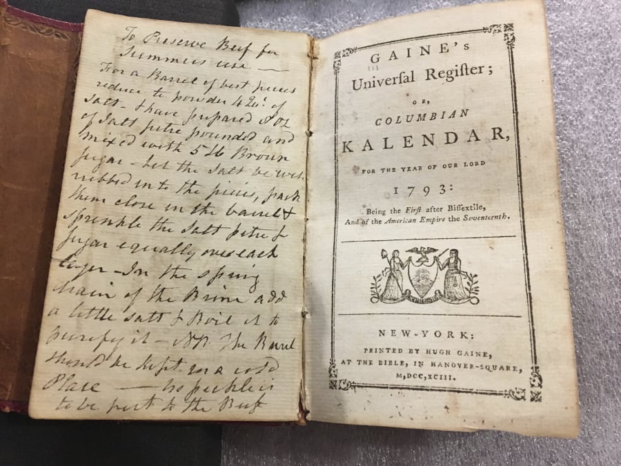 In this Feb. 14, 2018 photo, an old almanac that contained a lock of George Washington’s hair lay open on a table at Union College in Schenectady, N.Y. The hair was found by a Union College librarian who was cataloging books in the college’s archival collection.