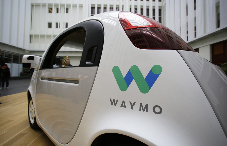 FILE - In this Dec. 13, 2016, file photo, the Waymo driverless car is displayed during a Google event in San Francisco. Uber is settling a lawsuit filed by Google’s autonomous car unit alleging that the ride-hailing service ripped off self-driving car technology. Both sides in the case issued statements confirming the settlement Friday, Feb. 9, 2018, morning in the midst of a federal court trial in the case.