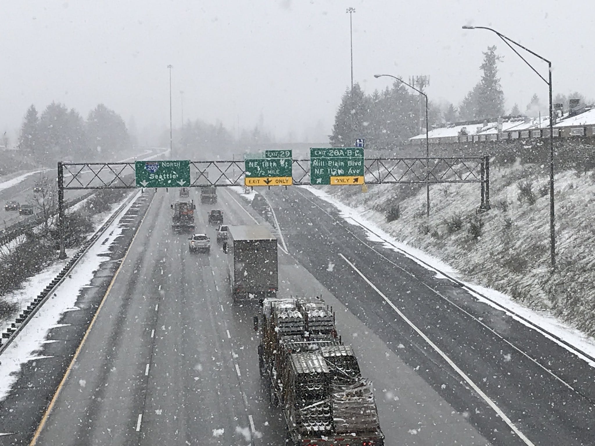 Traffic flows smoothly on Interstate 205 near Mill Plain Boulevard despite the snow on Tuesday morning.