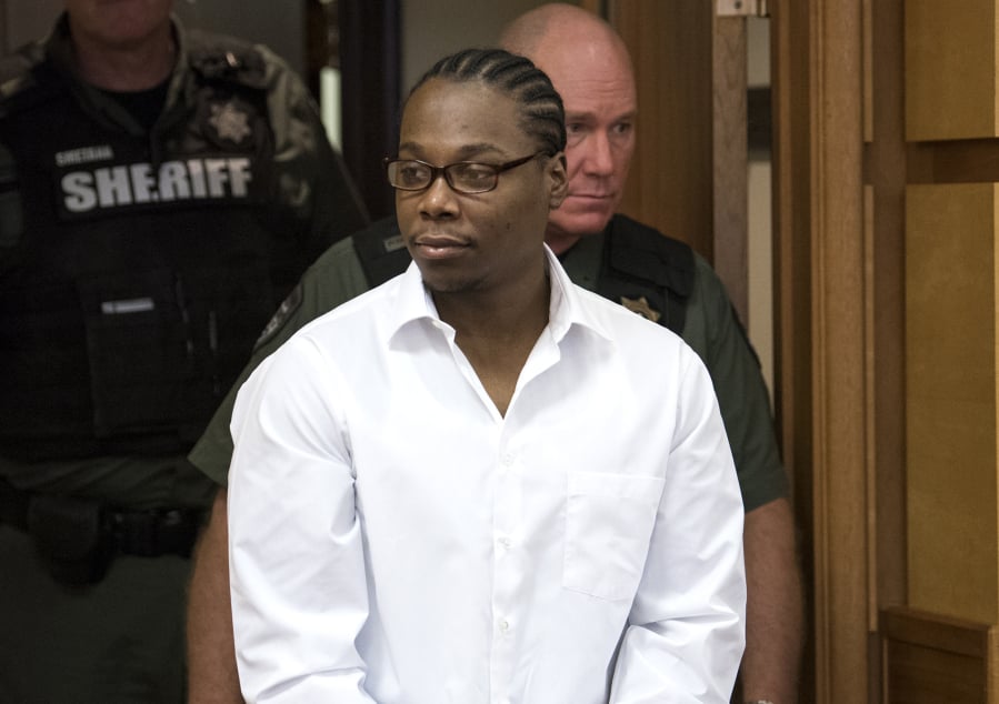 Arkangel D. Howard, accused of fatally shooting two men in March 2017, is escorted into court on Feb. 28 for the beginning of his murder trial. The case went to the jury Thursday afternoon.