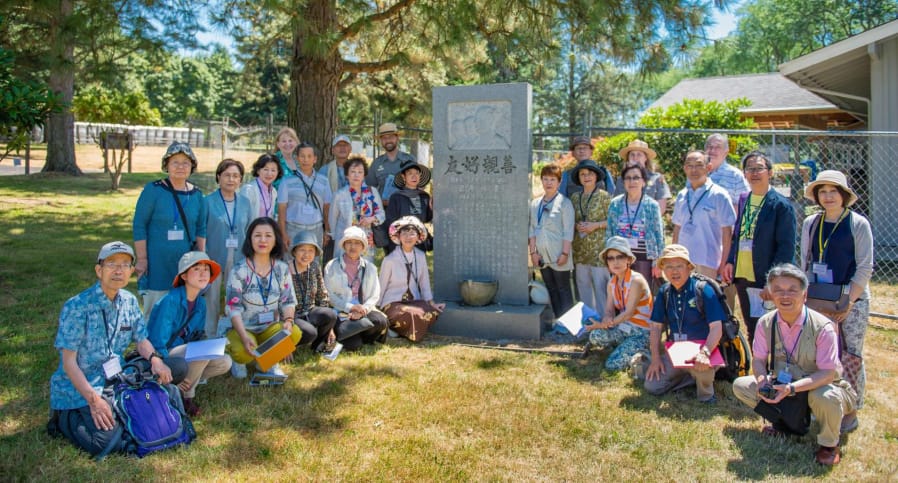 A sister-city delegation from Joyo, Japan, visits a monument to their castaway countrymen at the Fort Vancouver Visitor Center.