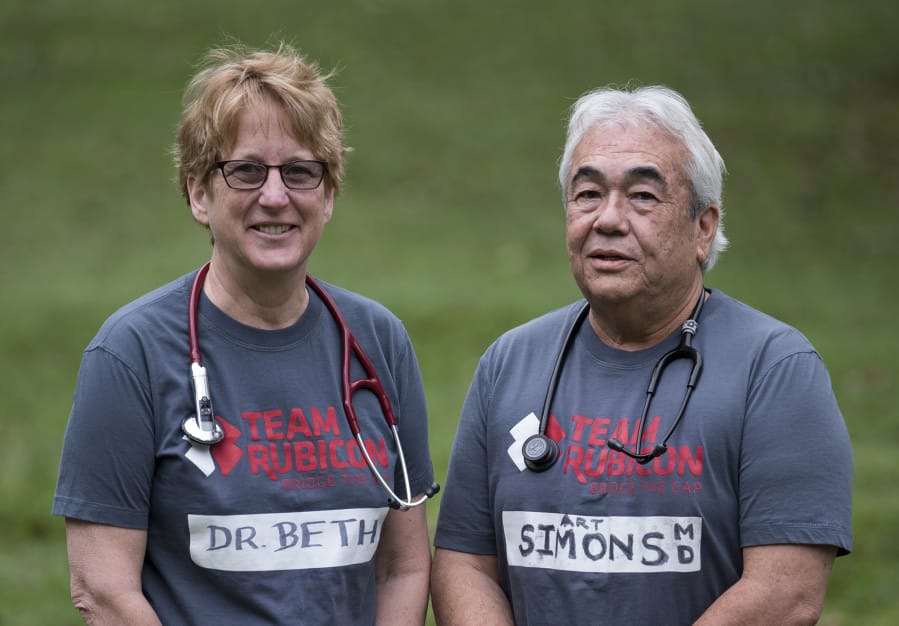 Dr. Beth Lee, left, and Dr. Art Simons volunteered for disaster relief with Team Rubicon, and Simons also made a trip with Project Hope.