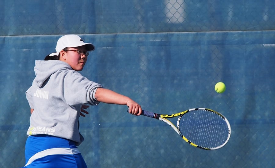 Mountain View junior Juwoon Kim returns a shot against Skyview’s Marissa Hunter in the No. 1 singles match on Tuesday, March 20, 2018 at Skyview High School. Kim won 6-0, 6-2.