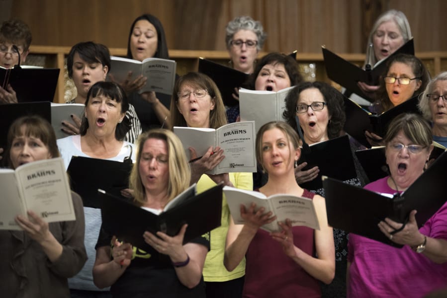 The Vancouver USA Singers rehearse for their upcoming performance of Brahms’ “German Requiem” on Monday evening at First Presbyterian Church in Vancouver. Nearly 100 singers and a small orchestra will perform in this weekend’s show.