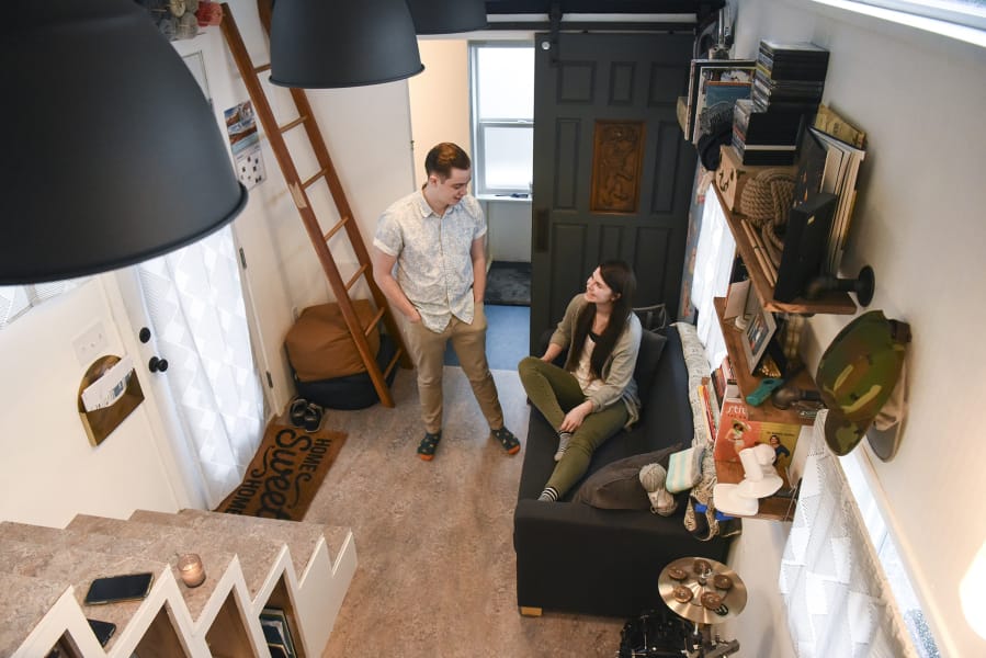 Ethan Woltersdorf, 21, left, and his wife, Morgan Woltersdorf, 22, live in a tiny house in Salmon Creek. The couple, whose tiny house is parked on a family member’s property, recently received a letter from Clark County Code Enforcement telling them their tiny house is not a legal dwelling.