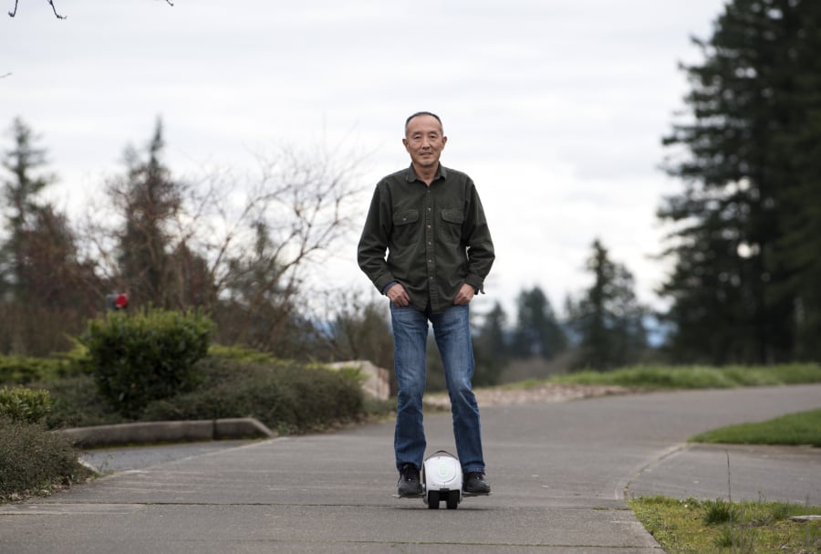 Camas-based inventor Shane Chen said he barely saw any profits from the hoverboard craze he helped start in 2015 with his invention, the Hovertrax. Knockoffs flooded the market and a typo in his patent later foiled attempts to sue. Here he demonstrates his latest invention, the IOTATrax, that he hopes to better protect.