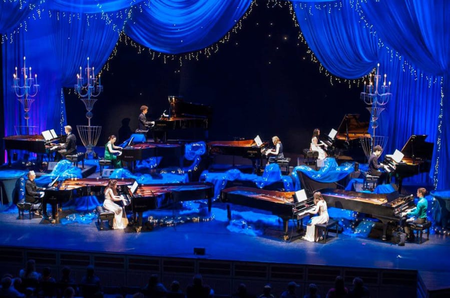 The “10 Grands” extravaganza in 2017 at the Arlene Schnitzer Concert Hall featured both Mac Potts (lower right in green) and his wife, Hailey (center in black).