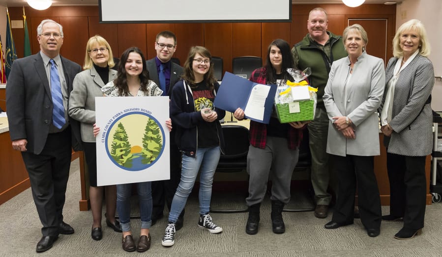 Orchards: The Clark County Council honored four Heritage High School students for work in a contest to design a new logo for the Clark County Parks Advisory Board. From left: Council Chair Marc Boldt, Councilor Jeanne Stewart, first-place winner Heidi Hayden, second-place winner Eli Entwistle, third-place co-winner Jennifer Jones, third-place co-winner Viktoria Kryshtal, Bill Bjerke, parks manager, Councilor Julie Olson and Councilor Eileen Quiring.