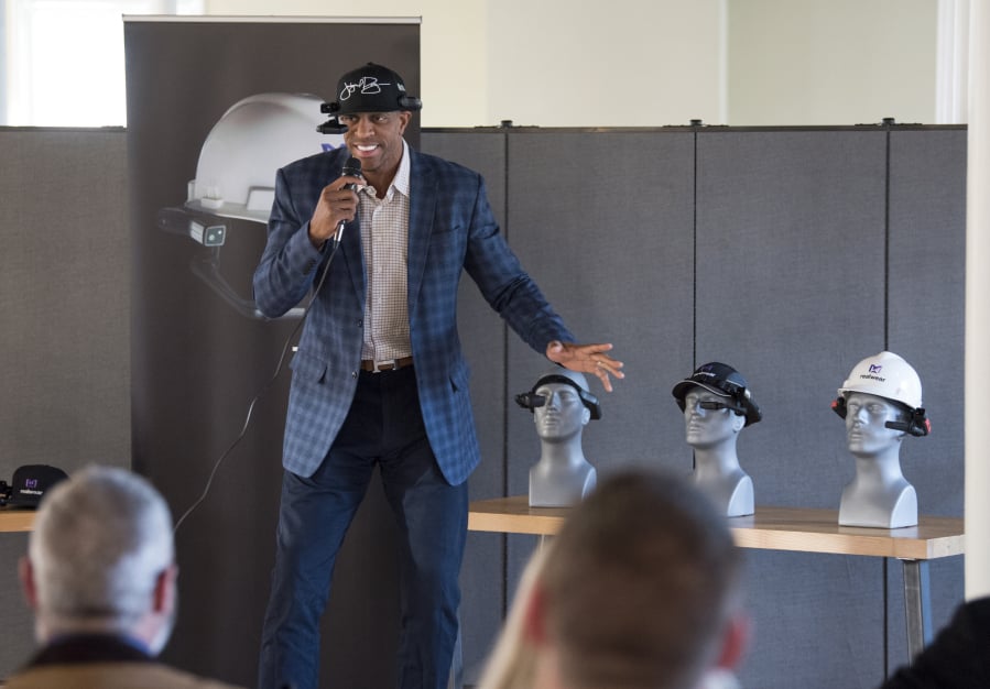 Retired professional basketball player Jerome Williams speaks during the GROW Clark County networking event, which featured hardware company RealWear. Williams joined the company’s advisory board in February and hopes to use its head-mounted computer to coach basketball.