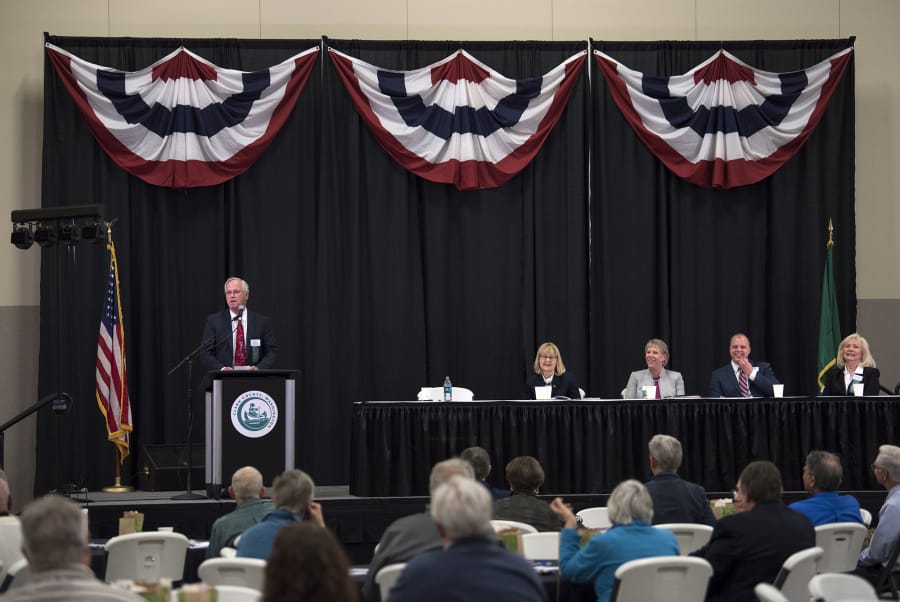 Clark County Council Chair Marc Boldt, left, welcomes the public to the 2018 State of the County event Tuesday at the Clark County Event Center at the Fairgrounds. The event was held at the fairgrounds to commemorate the 150th anniversary of the county fair.