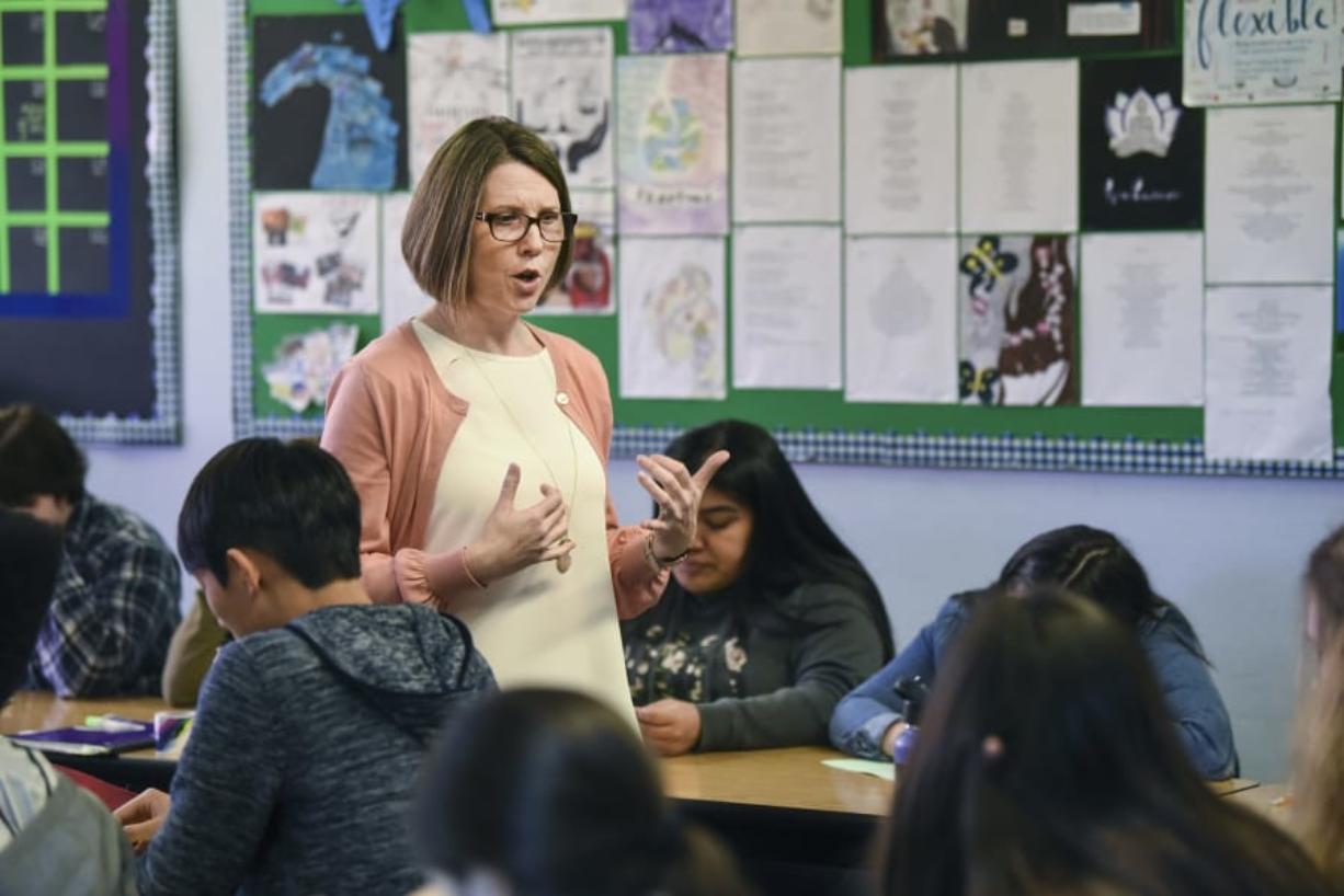 English teacher Marty Sampson explains to students in her junior class at Mountain View High School how to complete a project. Each student was assigned an identity and had to take a stance on and debate the merits of supporting local agriculture. The exercise mirrored the type of work students do in Advanced Placement classes. The school is raising the bar for its students in standard classes in hopes of encouraging more of them to sign up for AP classes, and to be college ready upon graduation.