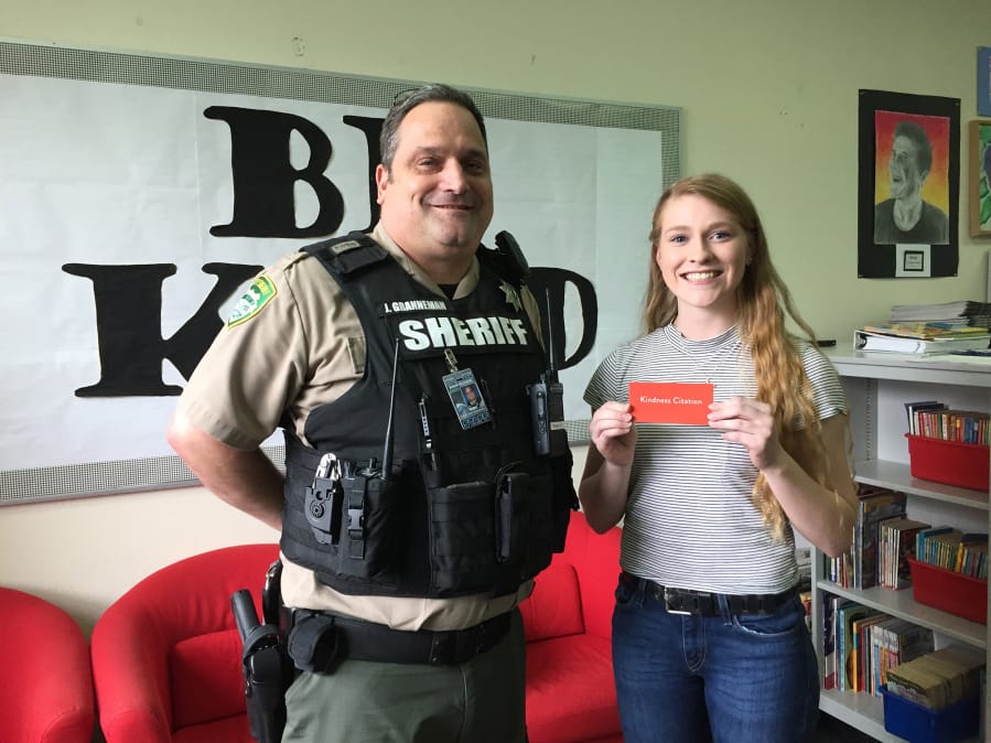 Brush Prairie: Clark County Sheriff’s Deputy Jason Granneman awards Hockinson High School senior Alyssa Chapin a kindness citation, making her the first recipient at the school since the sheriff’s office started presenting the citations in November.
