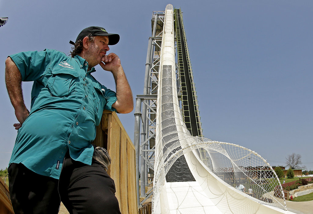 FILE - In this July 9, 2014, file photo, ride designer Jeffery Henry looks over his creation, the world's tallest waterslide called "Verruckt" at Schlitterbahn Waterpark in Kansas City, Kan. The Kansas City Star reports that Schlitterbahn Waterparks and Resorts co-owner Henry was arrested Monday, March 26, 2018, in Cameron County, Texas.