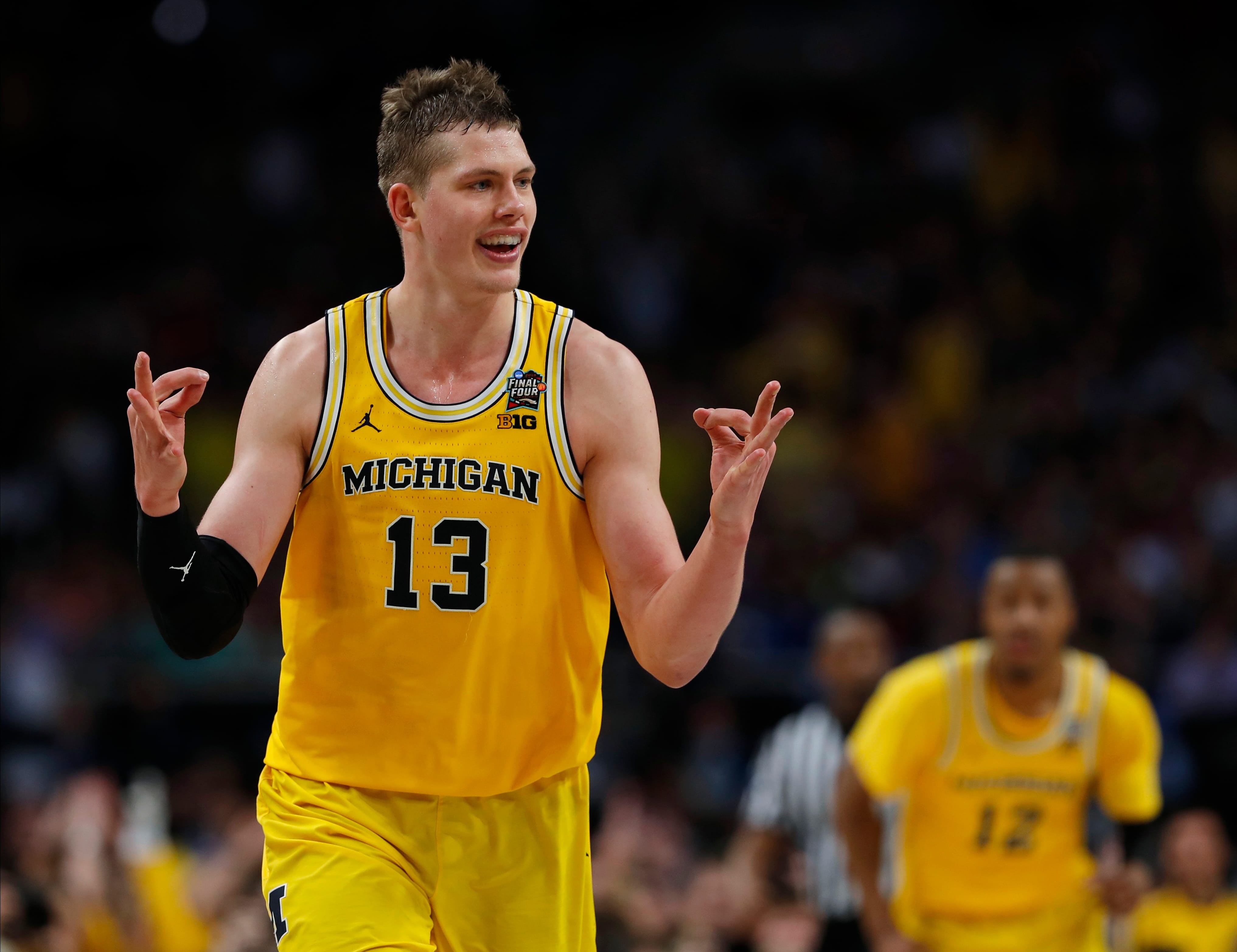 Michigan's Moritz Wagner (13) reacts after scoring a 3-point shot against Loyola-Chicago during the second half in the semifinals of the Final Four NCAA college basketball tournament, Saturday, March 31, 2018, in San Antonio.