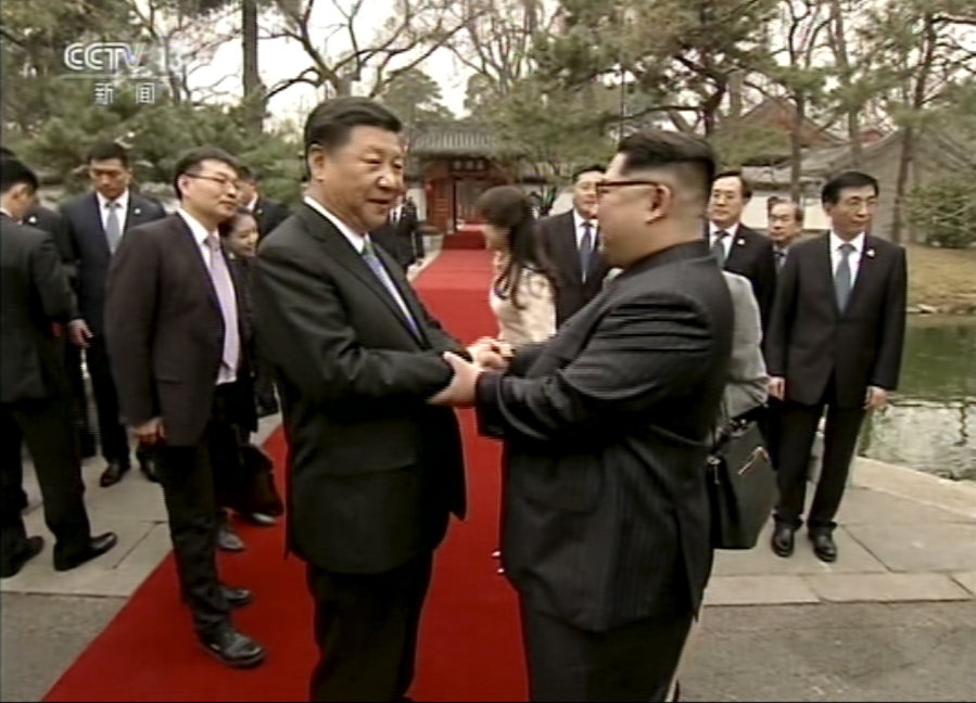 In this image taken from video footage run Wednesday, March 28, 2018, by China’s CCTV via AP Video, North Korean leader Kim Jong Un, right, and Chinese counterpart Xi Jinping, left, shake hands at Diaoyutai State Guesthouse in Beijing. North Korea’s leader Kim and his Chinese counterpart Xi sought to portray strong ties between the neighbors and long-time allies despite a recent chill, as both countries on Wednesday confirmed Kim’s secret trip to Beijing this week.
