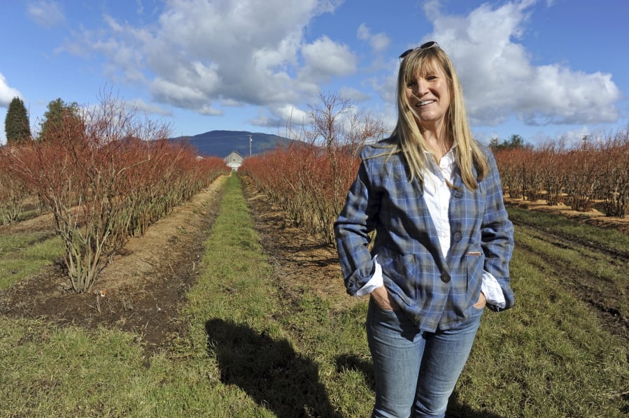 Bow Hill Blueberries owner Susan Soltes poses for a photo among her heirloom blueberry rows in Bown. They grow predominately storage crops — produce that is for sale in the typical offseason.