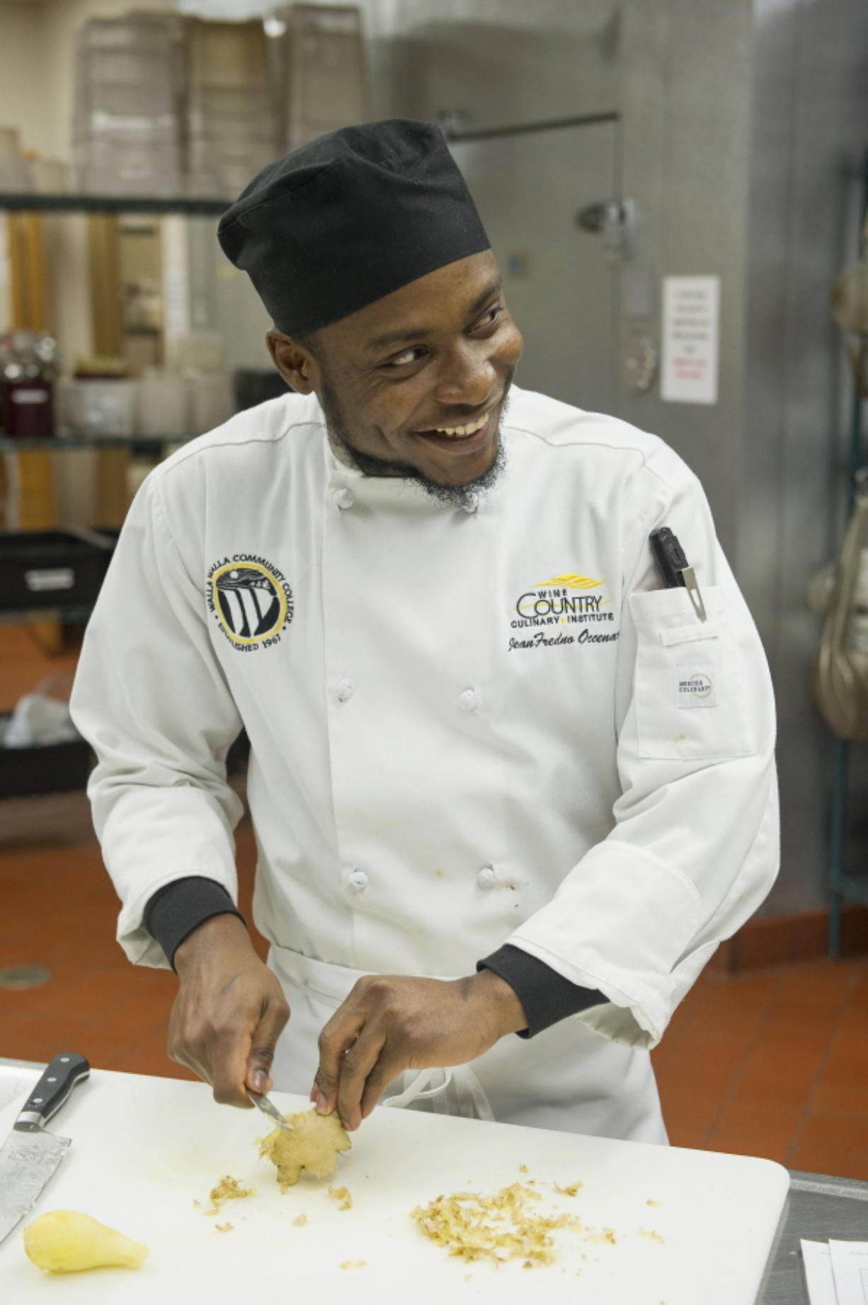 In this March 2, 2018, photo, Jean Fredno Occenc, Walla Walla Community College culinary student from Haiti, attends a cooking class at the school in Walla Walla, Wash. How the Haiti-born cook got here, and enrolled in Walla Walla Community College, is a tale of far more than destiny, however. It’s a story of one Tri-Cities family and their unexpected urge to change at least one life.