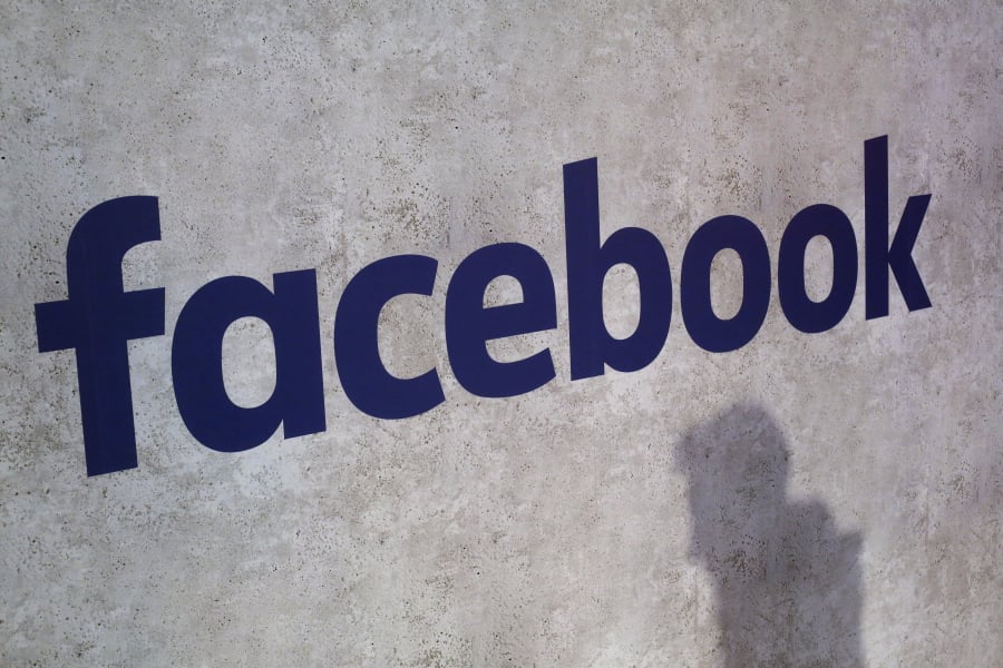 A Facebook logo is displayed in a gathering for startup companies in January 2017 at Paris’ Station F in Paris. A former employee of a Trump-affiliated data-mining firm says it used algorithms that “took fake news to the next level” using data inappropriately obtained from Facebook.