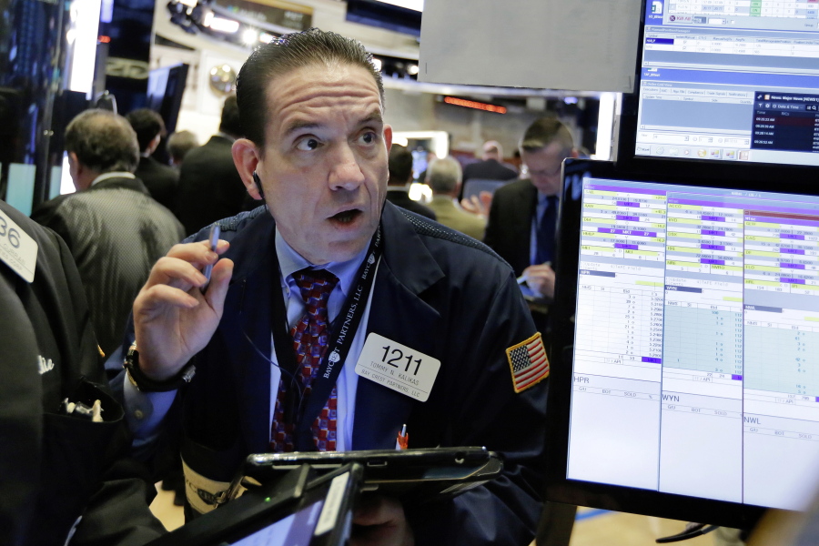 Trader Tommy Kalikas works on the floor of the New York Stock Exchange on Monday. U.S. stocks rose sharply in early trading Monday as the market made up some of its huge losses from last week.