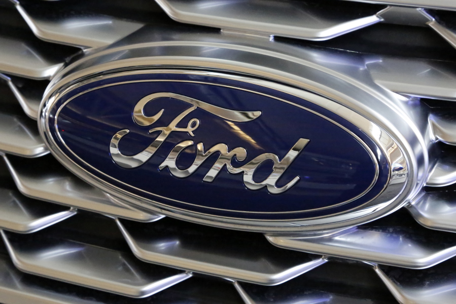 A Ford logo on the grill of a 2018 Ford Explorer is on display in February at the Pittsburgh Auto Show. Ford, with a sagging U.S. market share and one of the oldest vehicle lineups in the industry, is promising to revamp three-quarters of its models in the next two years. The move was detailed at a presentation on Thursday at Ford’s product development center in Dearborn, Mich. Gene J.