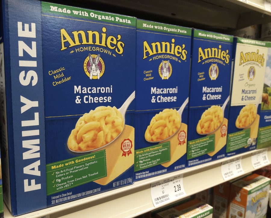Boxes of Annie’s Macaroni & Cheese are shown on the shelf at a supermarket in Edina, Minn., Sunday, March 4, 2018. Annie’s is an organic and natural unit of food industry giant General Mills, which announced a deal Tuesday to create a 34,000-acre organic farm in South Dakota to supply it with organic wheat that will become pasta for the popular product.