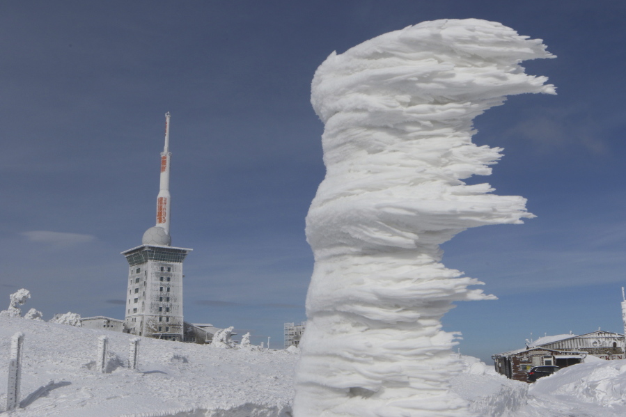Wind and white frost have formed an ice sculpture on Brocken mountain in the Harz region, Germany, Sunday, March 18, 2018.