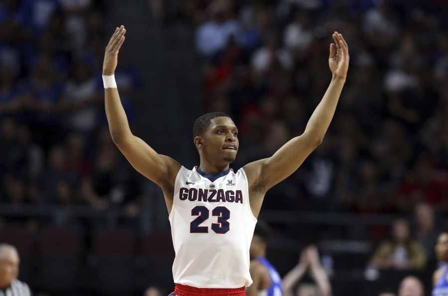 FILE - In this March 6, 2018 file photo Gonzaga’s Zach Norvell Jr. raises his hands to the crowd during the first half of the West Coast Conference tournament championship NCAA college basketball game against BYU in Las Vegas. Norvell is providing Gonzaga with fiery spark on the way to the Sweet 16. Norvell hit tiebreaking 3-pointer in NCAA Tournament opening round and scored 28 points in second round.