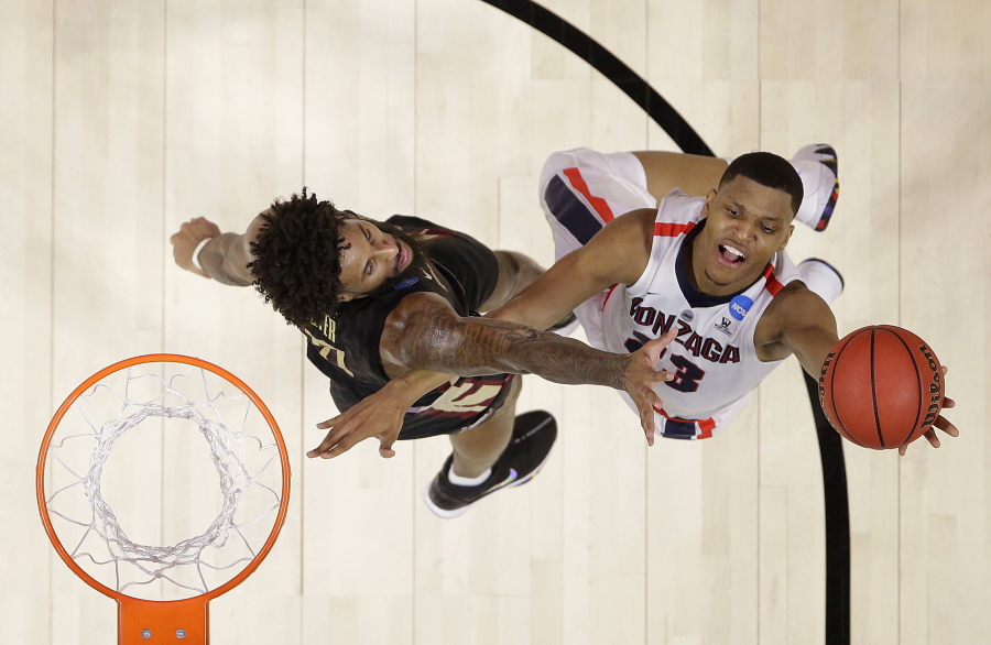 Gonzaga guard Zach Norvell Jr., right, shoots against Florida State forward Phil Cofer during the first half of an NCAA men’s college basketball tournament regional semifinal Thursday, March 22, 2018, in Los Angeles.