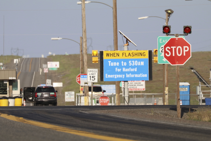 FILE - In this May 9, 2017, file photo, an emergency sign flashes outside the Hanford Nuclear Reservation in Benton County Tuesday in Washington state. The federal government is demanding that the company building a giant nuclear waste treatment plant in Washington state provide records proving that the steel used in the nearly $17 billion project meets safety standards.