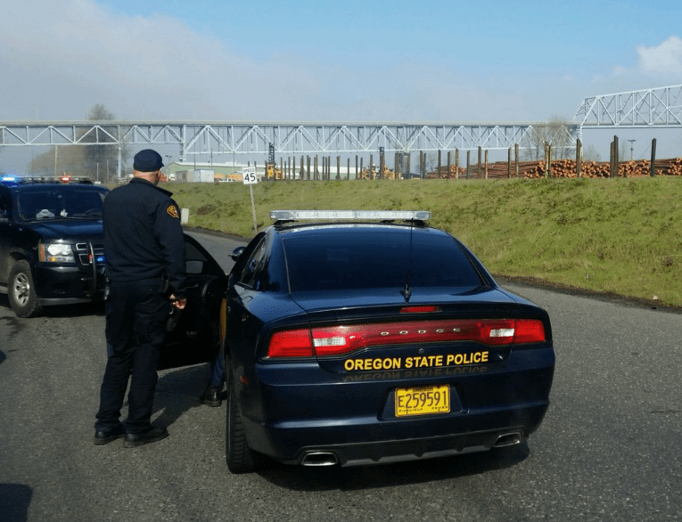 The Oregon State Police bomb squad are investigating several suspicious bags that were hung from the Lewis and Clark Bridge between Longview and Rainier, Ore.