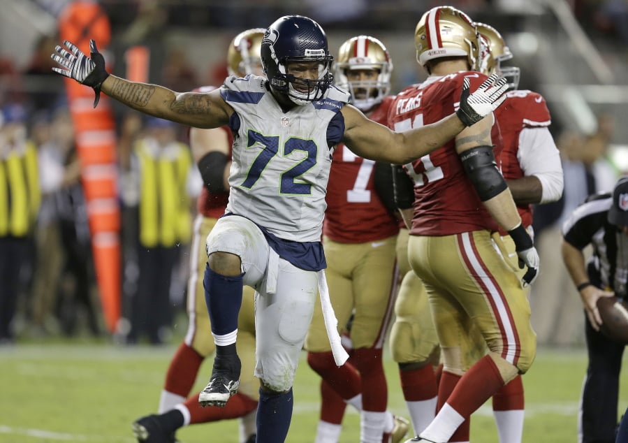FILE - In this Oct. 22, 2015, file photo, Seattle Seahawks defensive end Michael Bennett (72) reacts after sacking San Francisco 49ers quarterback Colin Kaepernick during the second half of an NFL football game in Santa Clara, Calif. The Super Bowl champion Philadelphia Eagles have acquired three-time Pro Bowl defensive end Michael Bennett from the Seattle Seahawks, two people familiar with the trade told The Associated Press Wednesday, March 7, 2018.