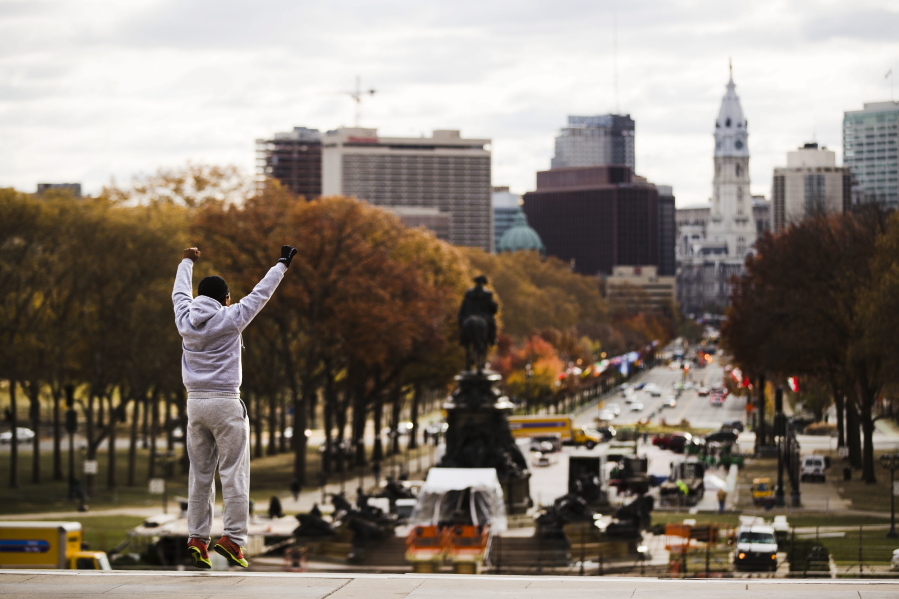 Alex Carrillo Quito of Ecuador imitates the character Rocky Balboa from the 1976 movie “Rocky,” on the steps of the Philadelphia Museum of Art, in Philadelphia.