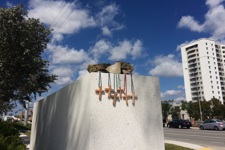 Six crosses are placed Saturday at a makeshift memorial near the scene of a pedestrian bridge collapse in Miami.