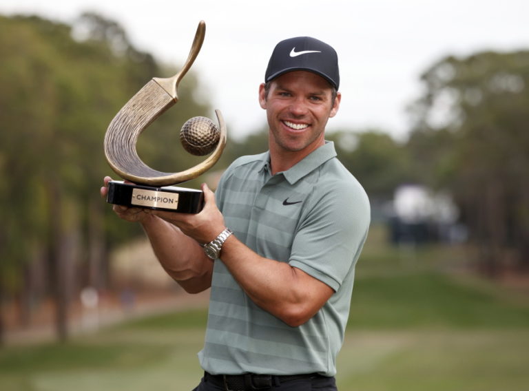 Paul Casey holds up the champion’s trophy after winning the Valspar Championship golf tournament Sunday, March 11, 2018, in Palm Harbor, Fla.