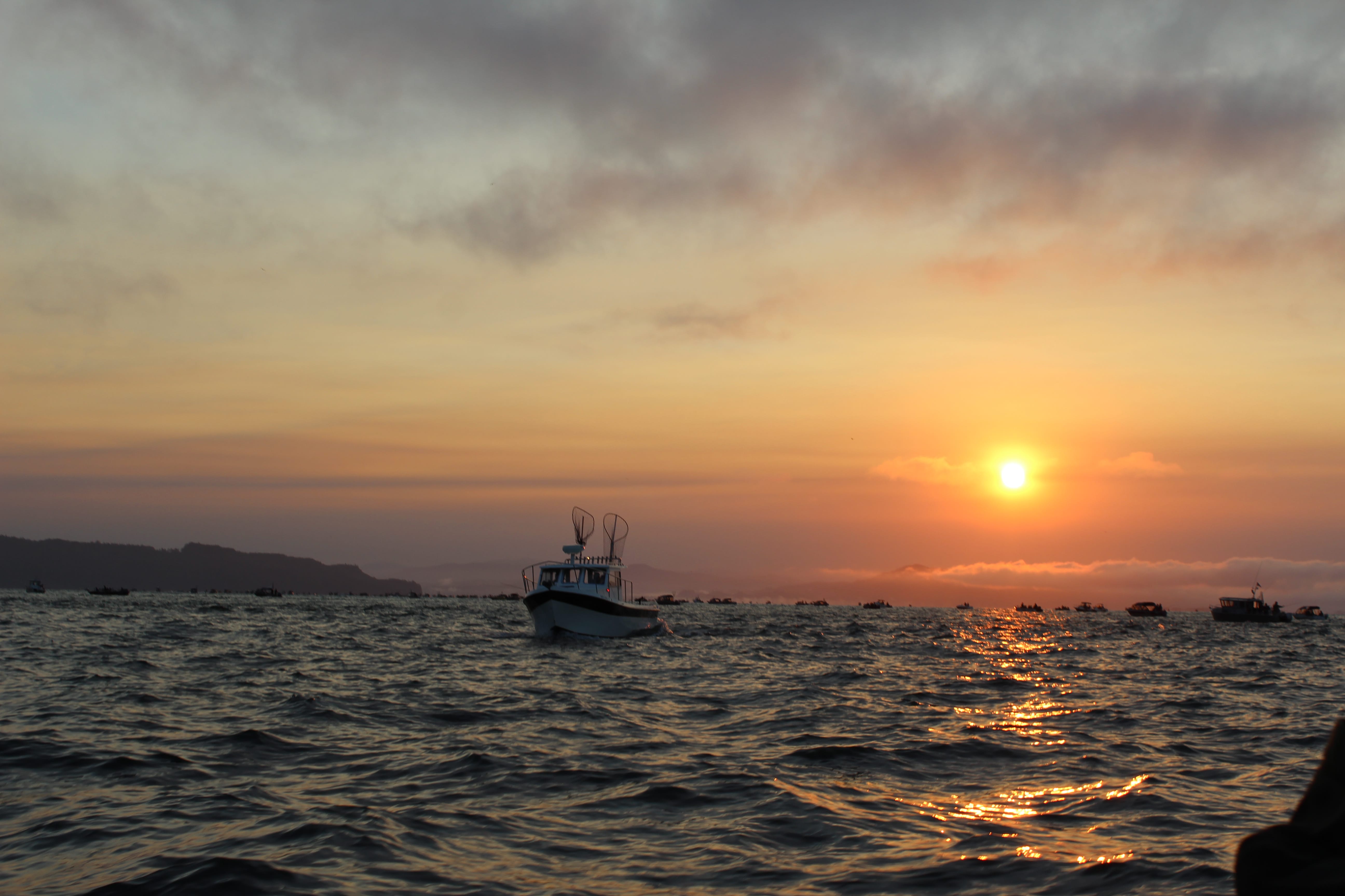 The sun sets upon anglers at the mouth of the Columbia River last summer. Poor returns mean fishermen are facing steep reductions in opportunities for fall salmon and summer steelhead this year. Fisheries along Washington’s coast and in the Columbia River will be affected.