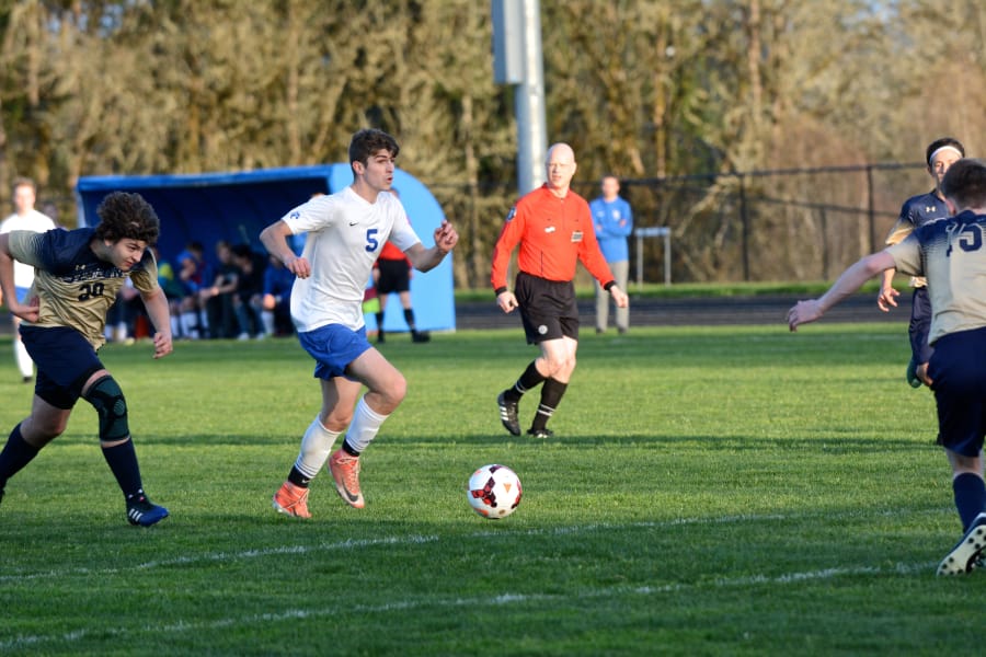 La Center forward Alec Watkins dribbles at the top of the 18-yard box in the first half of a 7-0 win over Seton Catholic on Tuesday, April 10, 2018 at La Center High School (Andy Buhler/Columbian staff). Watkins had a hattrick.
