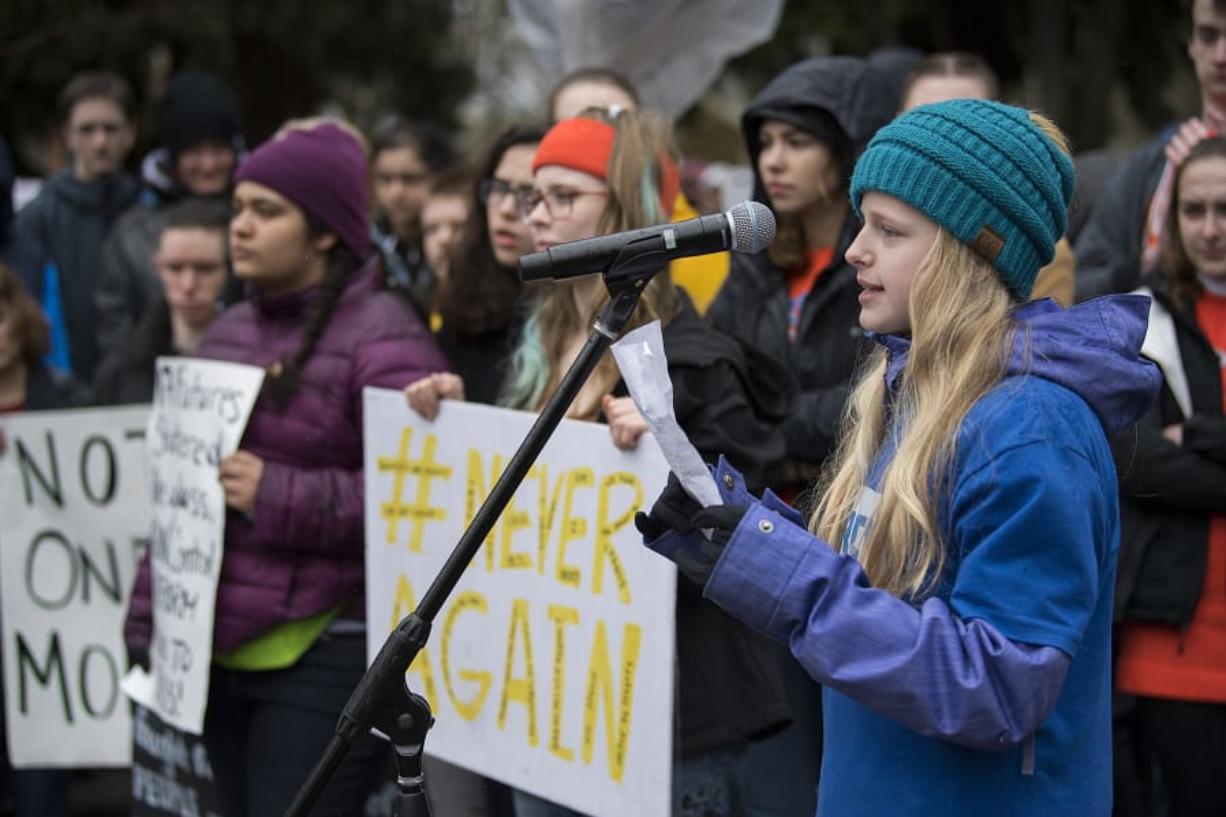 Matthea Freitag, 12, of Vancouver joins fellow students as she speaks about gun control to the crowd at Esther Short Park during the Vancouver March For Our Lives event.