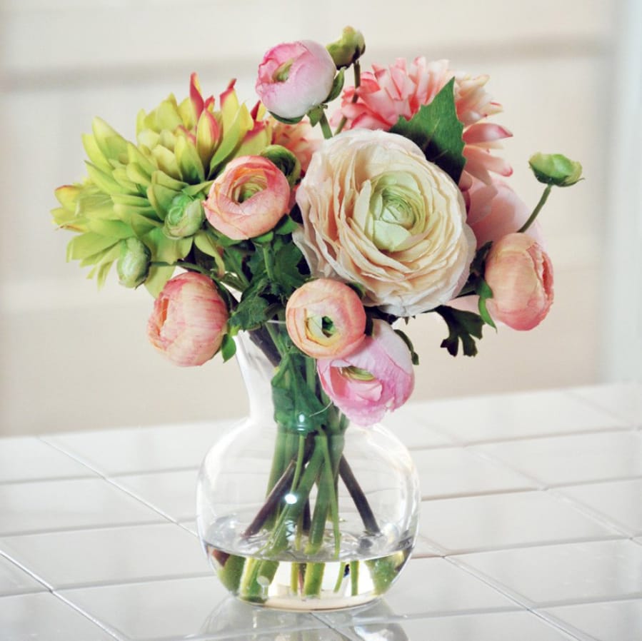 A dahlia ranunculus floral arrangement in a decorative vase ($190.99, jossandmain.com).