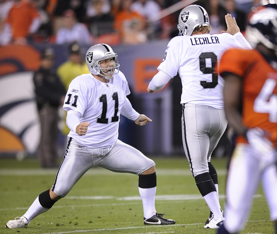 Oakland kicker Sebastian Janikowski (11) celebrates with holder Shane Lechler (9) after kicking a 63-yard field goal in 2011. Janikowski will compete for the kicking job with the Seattle Seahawks in 2018, having signed with the team on Friday, April 13, 2018.