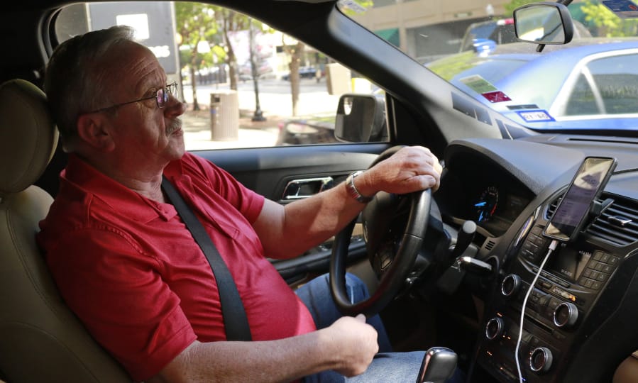 Johnny Pollard, of Haltom City, Texas, drives for Uber full time and says the job has saved him from unemployment and provided him with a good living.